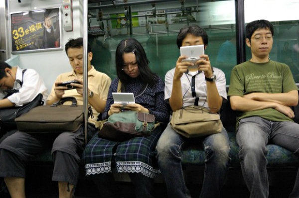2. 'Lots of adults can be seen playing smartphone games'